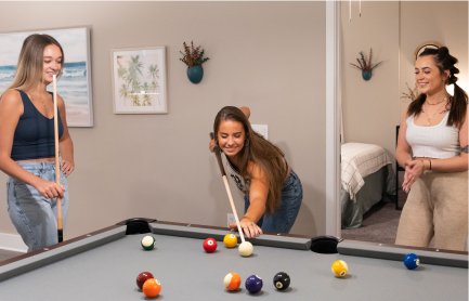 a woman playing pool
