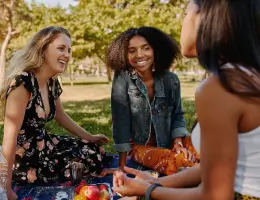young adults enjoying a picnic